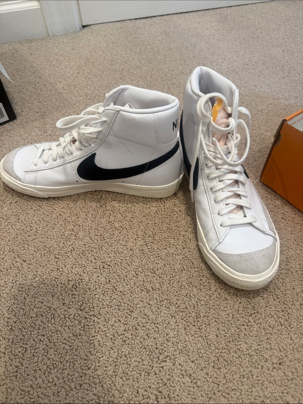 Nike White High-Top Sneakers with Black Swoosh Accents